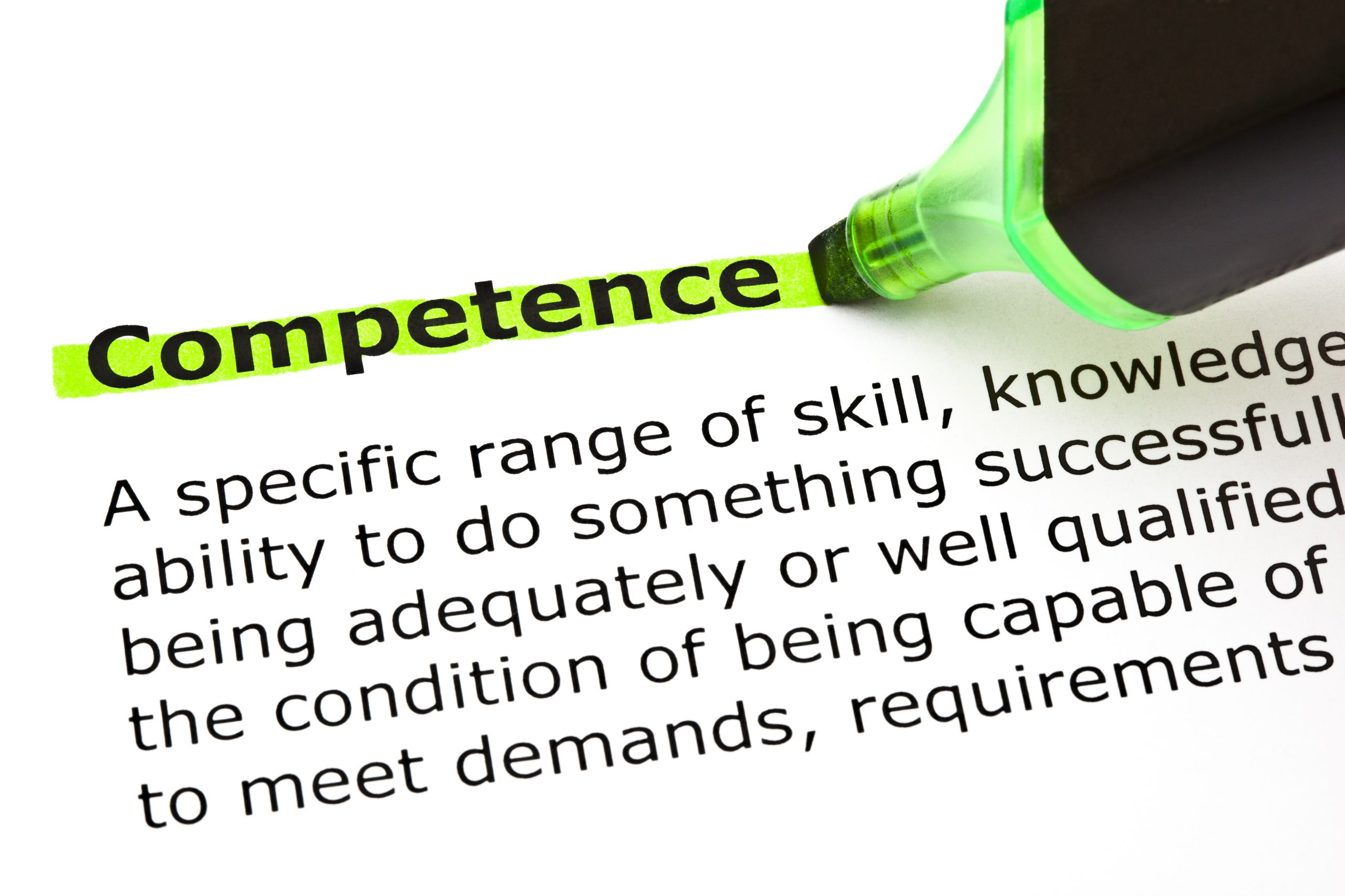 Definition of the word Competence highlighted in green with felt tip pen